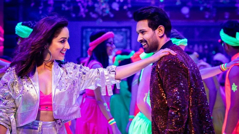A lavish Delhi wedding scene, strings of marigolds and fairy lights draped across a courtyard, guests in vibrant traditional attire milling about under a golden glow