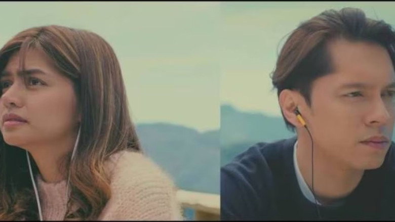 A split-screen moment where Ikay and Uly sit in the same physical space but different timelines, the divide between them marked by a thin line of light.