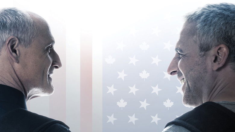 A wide shot showing the two protagonists walking through an industrial, snowy setting