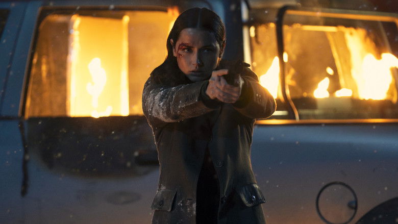 Eve standing in the snow-covered courtyard, weapon drawn