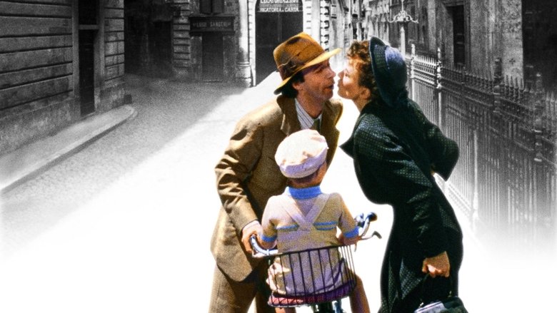 Guido riding a bicycle with his family through the town square