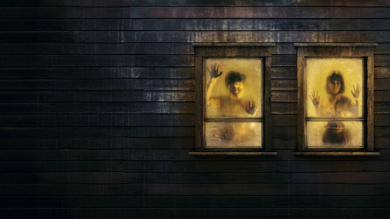 Two children huddle in a dimly lit room, their faces illuminated by a single sliver of light, eyes wide with fear.
