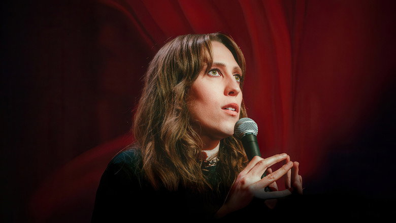 Jensen mid-performance, bathed in red light, her face a mix of exhaustion and defiance