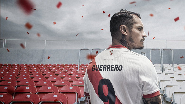 A dimly lit room where Paolo Guerrero sits alone, his face half in shadow, the steam from his tea curling into the air