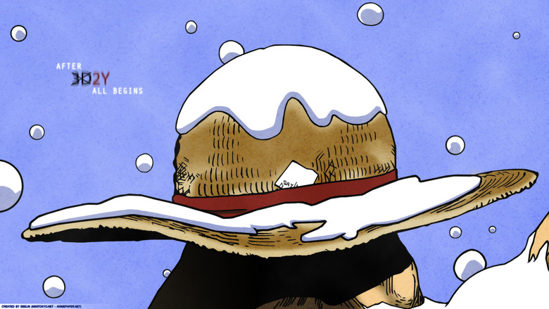Luffy sitting alone on a rocky shore, the ocean stretching endlessly behind him