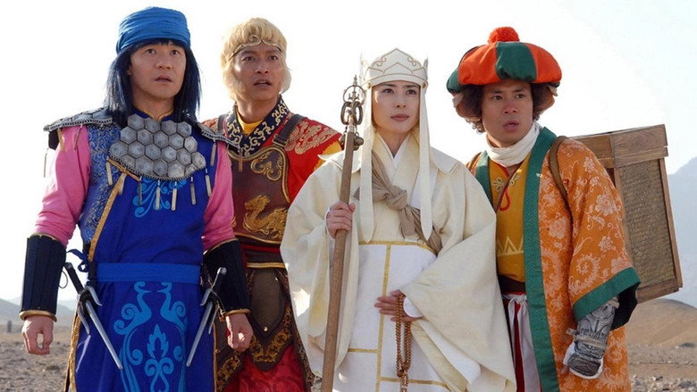 A monk and his companions stand at the edge of a cliff, the vast landscape stretching behind them, as if poised for the next leg of their journey.