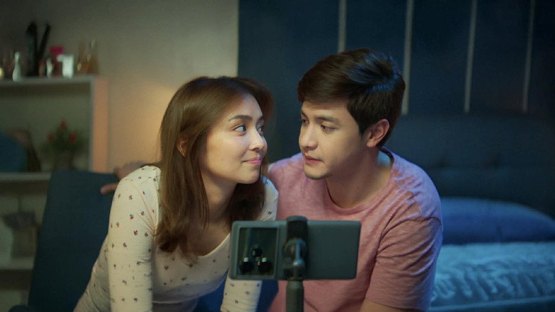 Joy and Ethan in a dimly lit room, their faces half in shadow, the weight of unspoken words hanging between them.