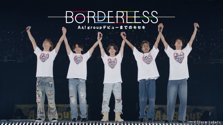 A dimly lit rehearsal space, the five members of Aぇ! group mid-dance, their faces half-lit by stage lights, expressions a mix of concentration and exhaustion.
