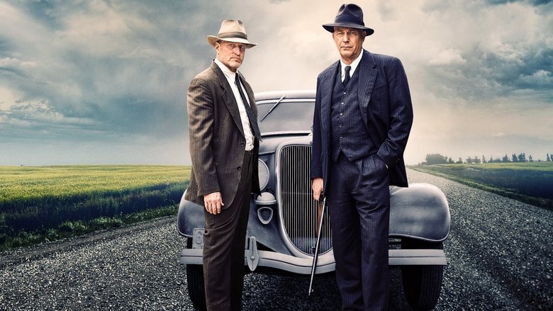 Two men in a car, one driving, the other staring ahead with a weary expression