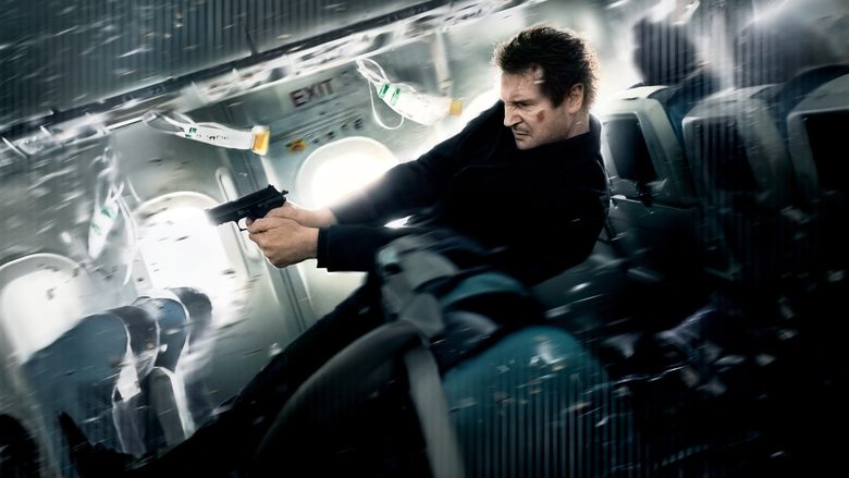 Liam Neeson as Bill Marks, standing in the airplane aisle, his face half-lit by the overhead lights, scanning the passengers with a mix of exhaustion and suspicion.