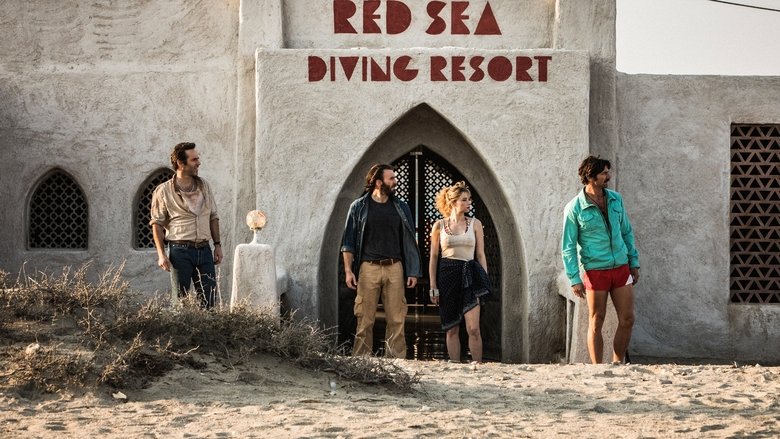 Ari Kidron (Chris Evans) stands on the resort's balcony, overlooking the Red Sea, the weight of the operation etched into his posture.