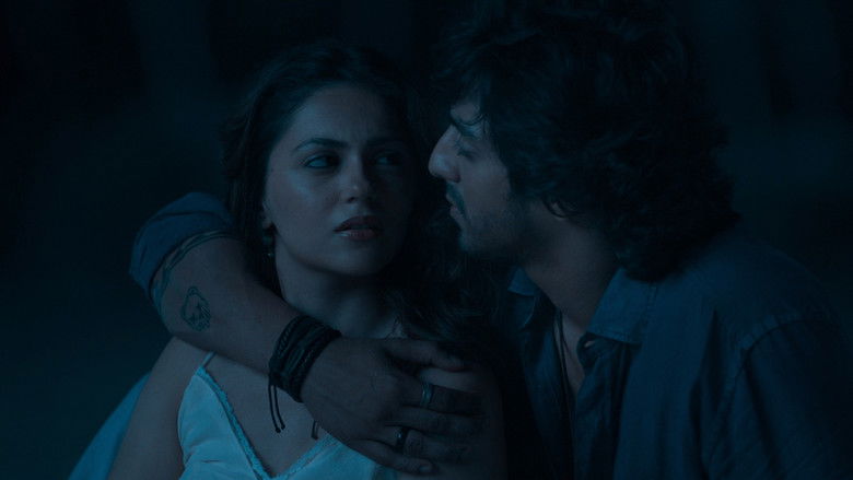 A quiet moment of musical collaboration under dim city lights