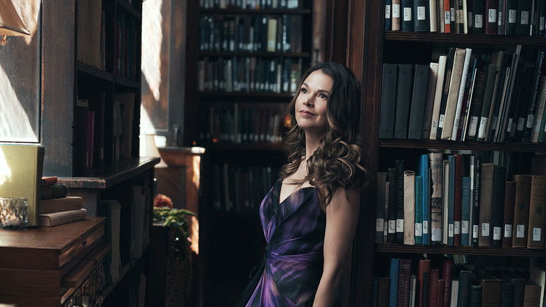 Liza and her friends sharing a moment of genuine connection amidst the lies