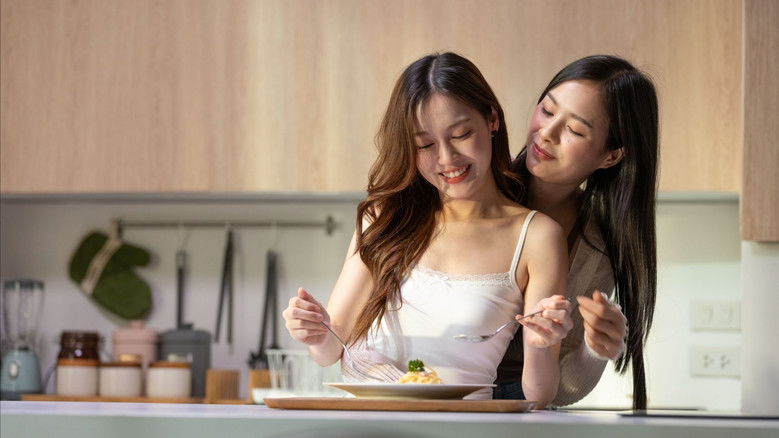 A solitary character looking out from a balcony, conveying the isolation that often accompanies group dynamics.