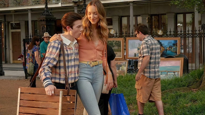 Ava Michelle as Jodi Kreyman standing in a high school hallway, surrounded by friends, her expression caught between a smile and something more uncertain