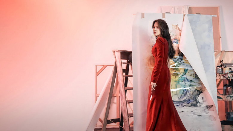 A woman in a gallery, her reflection fractured in a mirror