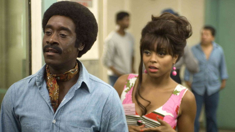 Don Cheadle as Petey Greene, mid-laugh, his face lit with the kind of charisma that makes you lean in closer.