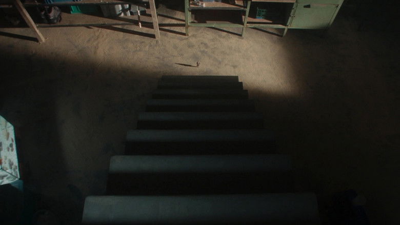 A close-up of Paul's exhausted face amidst giant debris