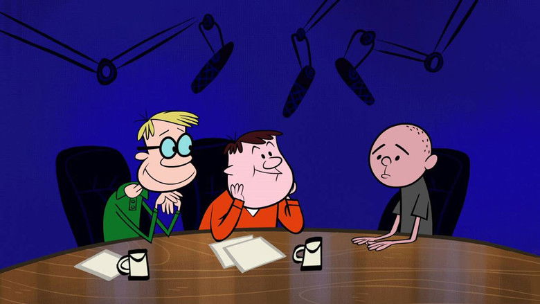 The trio seated at a table, Karl mid-sentence with an earnest expression, while Ricky and Stephen exchange amused glances