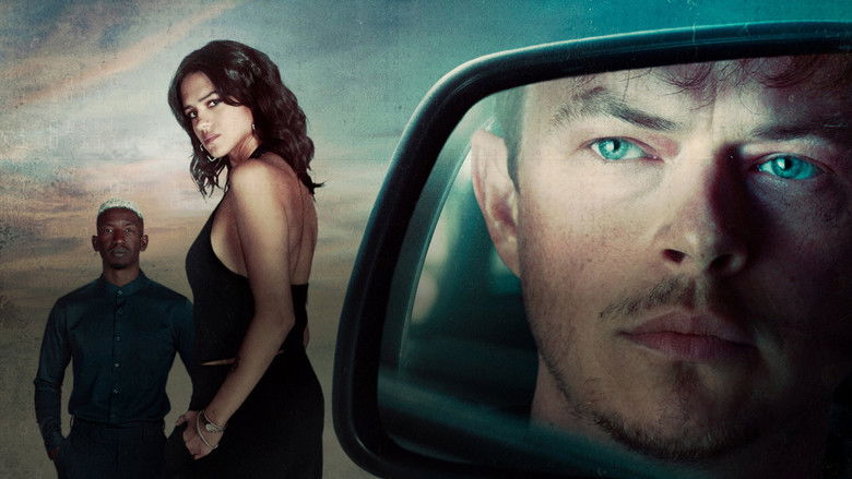 A wide, desaturated shot of an urban alleyway, dimly lit by a flickering streetlamp