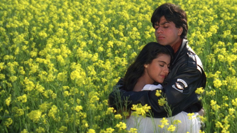 Raj and Simran running through a golden mustard field, the wind catching Simran’s dupatta as she laughs, Raj’s arm around her waist