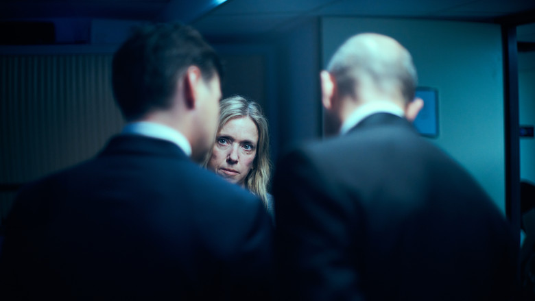 Stéphanie sitting alone in the office, reflecting on the case