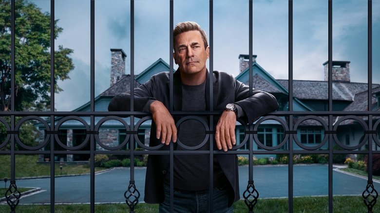 A wide shot of a sterile, modern living room at twilight, focusing on the emptiness of the space rather than the furniture.