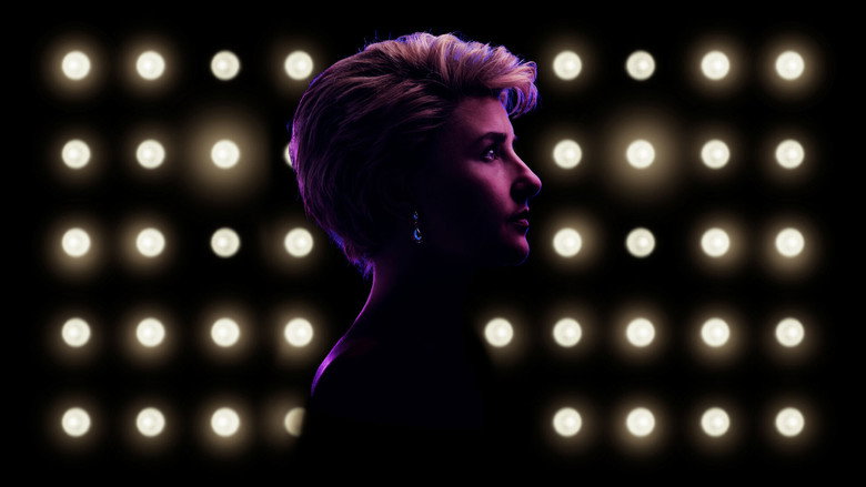A spotlighted Diana, in a shimmering blue gown, singing directly to the audience as the ensemble freezes in tableau behind her.