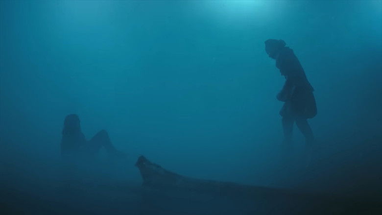 A terrified child hiding behind a rusted car in the woods