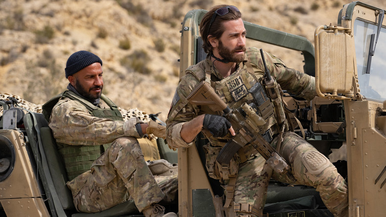 Ahmed dragging Kinley on an improvised cart