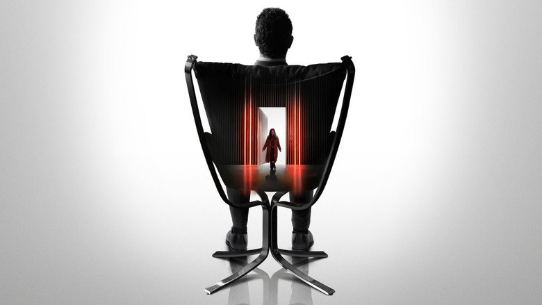 A woman in a dimly lit room, her face half in shadow, staring blankly ahead as if lost in thought.