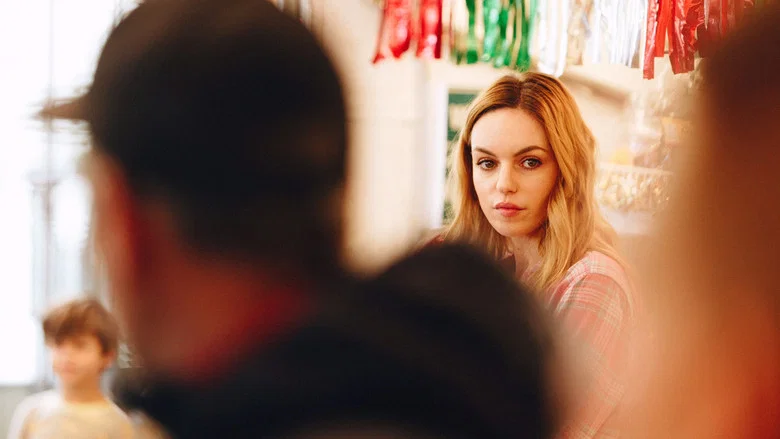 A chaotic scene inside the liquor store, with characters mid-argument, shelves toppled, and holiday decorations askew