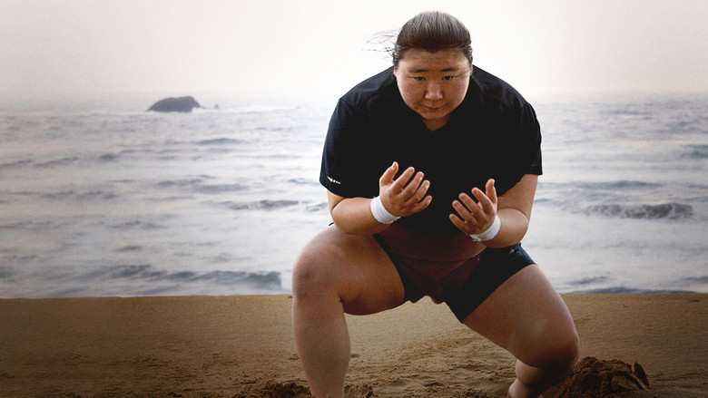 Hiyori Kon stands in the sumo ring, her expression a mix of focus and quiet resolve.