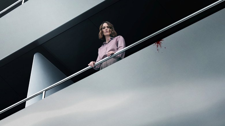 Lo Blacklock looking out at the dark, expansive ocean from the balcony of the luxury yacht