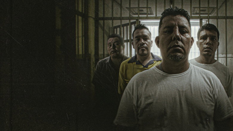 A dimly lit interrogation room, the camera positioned behind a one-way mirror, capturing the silhouette of a detained figure