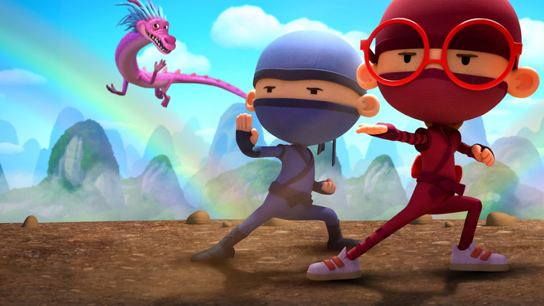 Wesley and Georgie in their ninja outfits, standing atop a pile of pillows that have become a mountain in their imagination