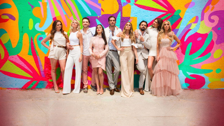 A group of elegantly dressed socialites standing in a sunlit courtyard, their expressions a mix of polite smiles and barely concealed tension