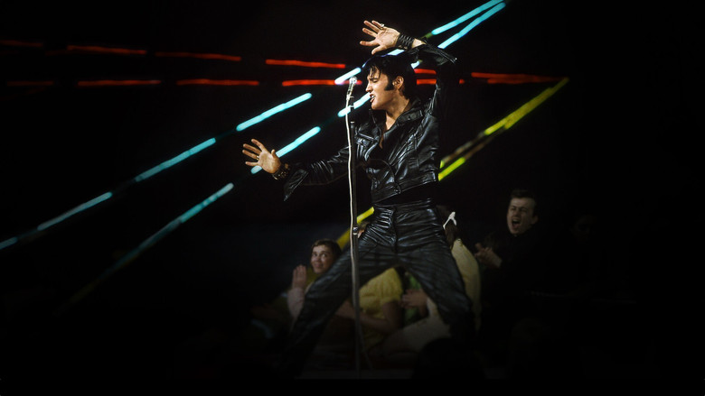 Elvis in black leather, mid-performance, bathed in the stark white light of the '68 Comeback Special
