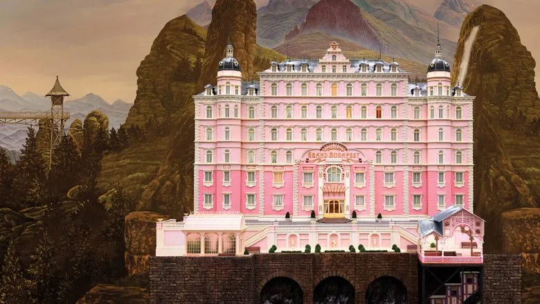 A sprawling exterior of the Grand Budapest Hotel perched on a snowy mountain