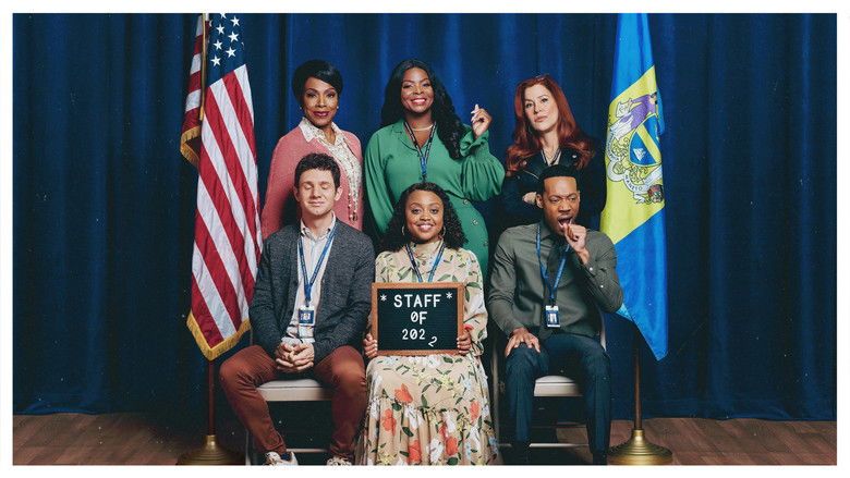 Janine Teagues standing in a brightly decorated classroom