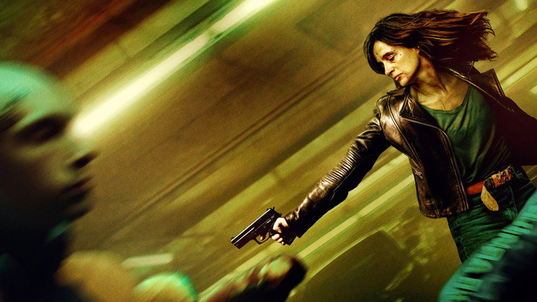 Nina, mid-fight, wielding a kitchen knife against a blurred assailant in a dimly lit room