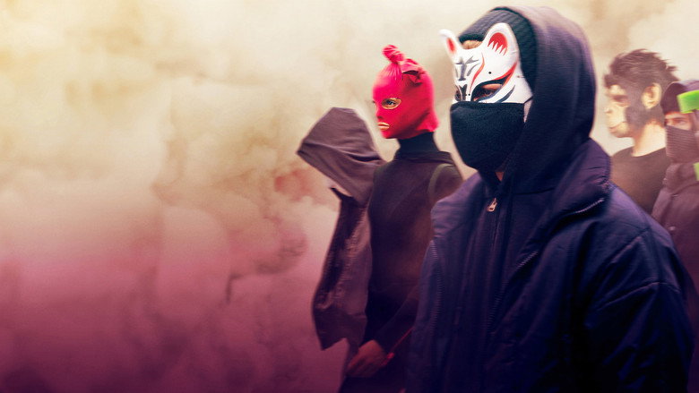 A group of masked teenagers stand in a dimly lit alley, their faces obscured by identical white masks, their postures tense with purpose.