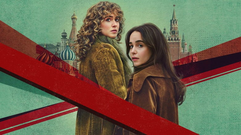 Bea and Twila looking over documents in a dimly lit Moscow apartment