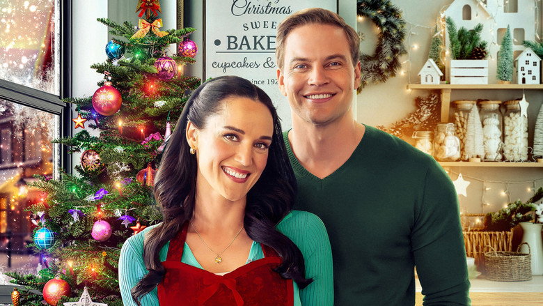 Libby and Peter standing on opposite sides of a bakery counter, glaring at each other with flour dusted on their cheeks