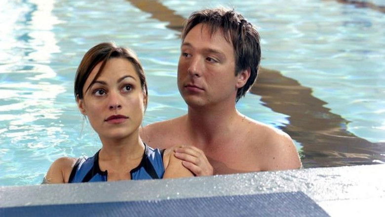 Three friends walking through a dimly lit city street at night, capturing the camaraderie and aimlessness of their youth