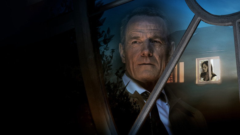Howard Wakefield peers through the attic window, his face half-lit by the dim glow of the suburban night.