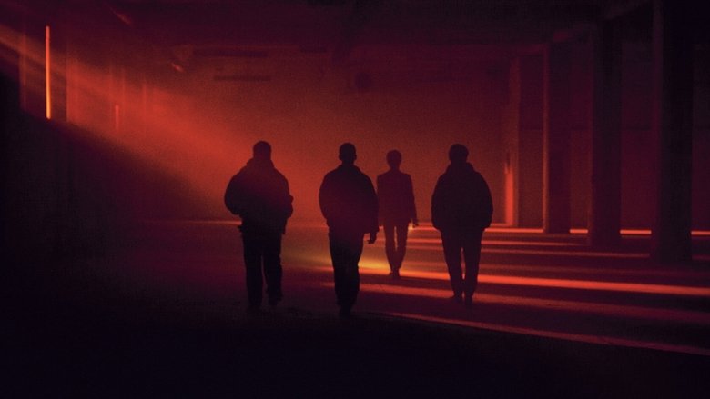 A desolate urban street at night, neon signs reflecting off wet pavement, the four protagonists huddled in the glow of a flickering storefront.