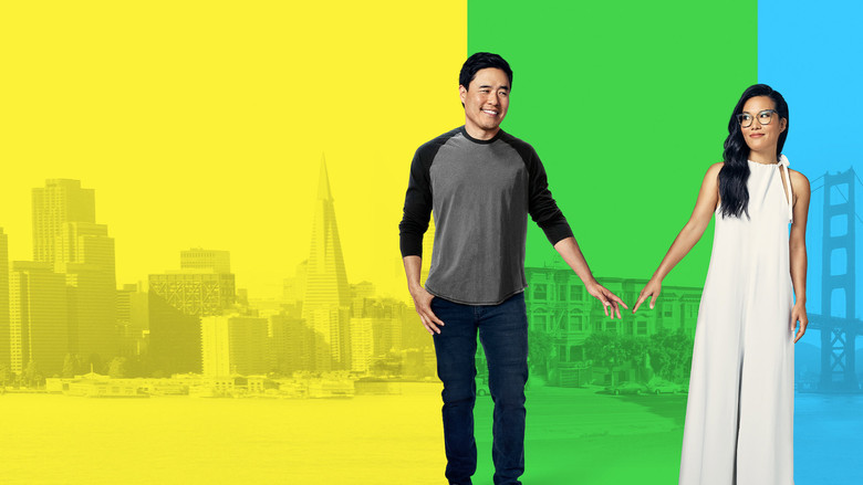 Sasha and Marcus walking through a sunlit San Francisco street, the city’s hills stretching behind them