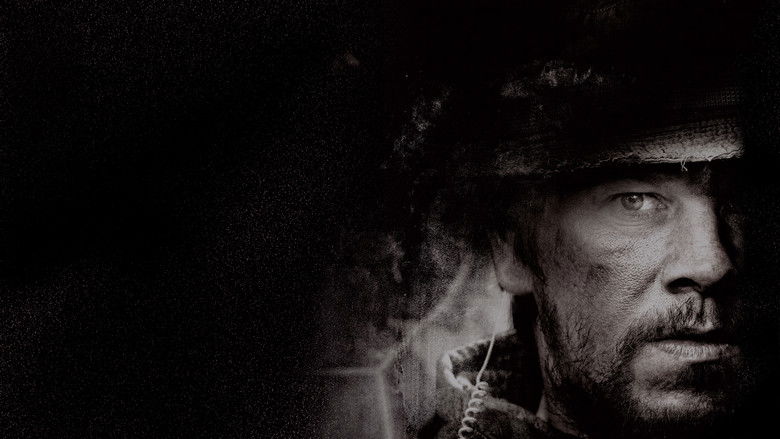 A lone soldier aiming his rifle amidst the dust and chaos