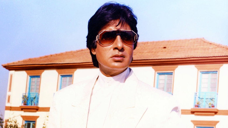 Amitabh Bachchan as Vijay Deenanath Chauhan, his face half-lit by shadow, eyes burning with quiet fury